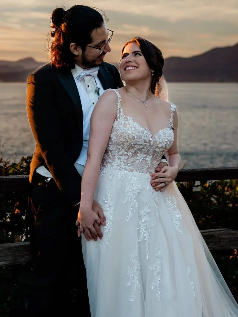 Bride in the Amanda lace A-line gown by Angeo with her groom at a waterfront sunset — Ethereal Bridal, Port Moody