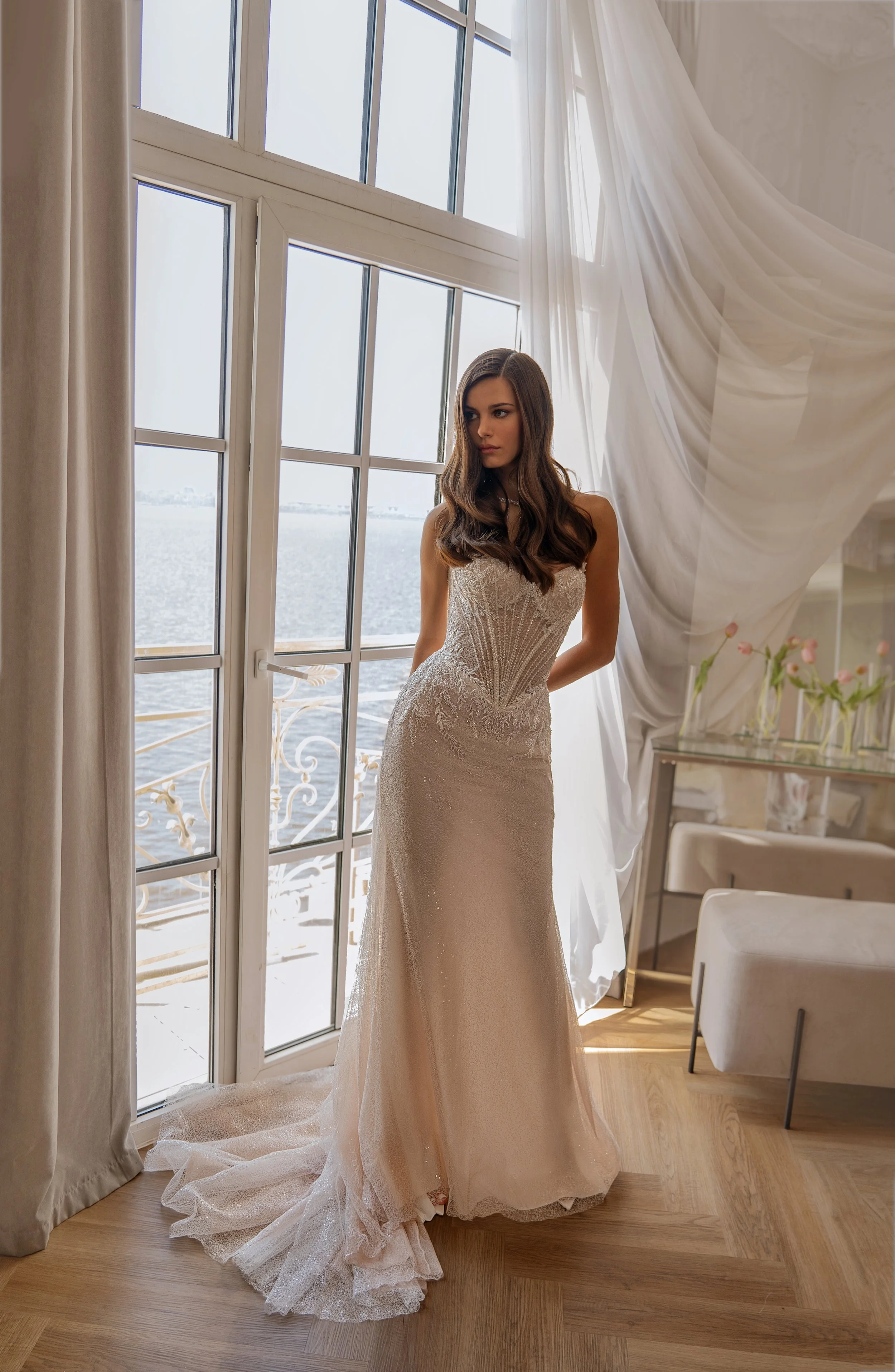 Delli mermaid wedding dress with peaked neckline and deep basque waist front view