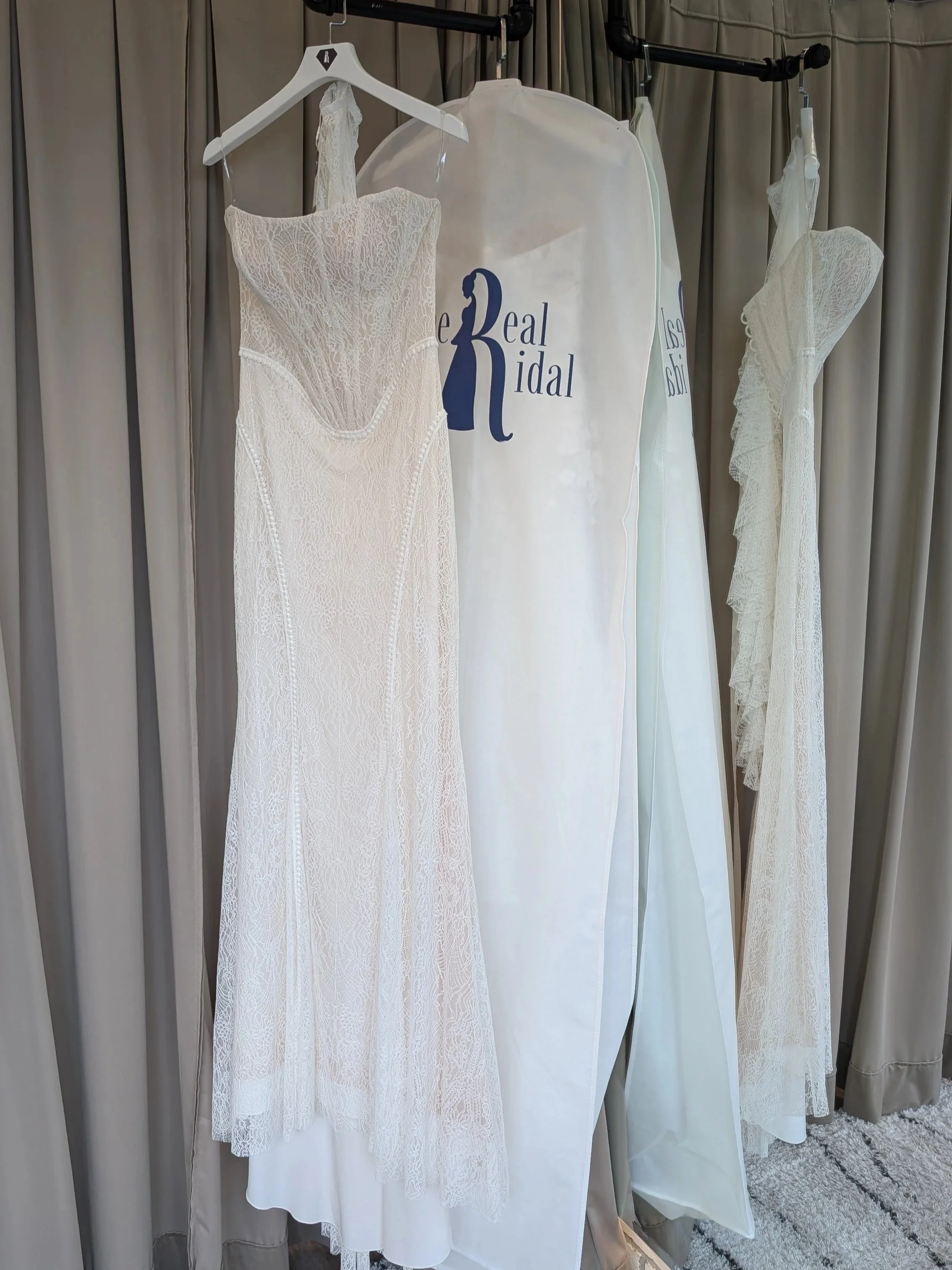 Wedding gowns in Ethereal Bridal garment bags hanging ready for travel