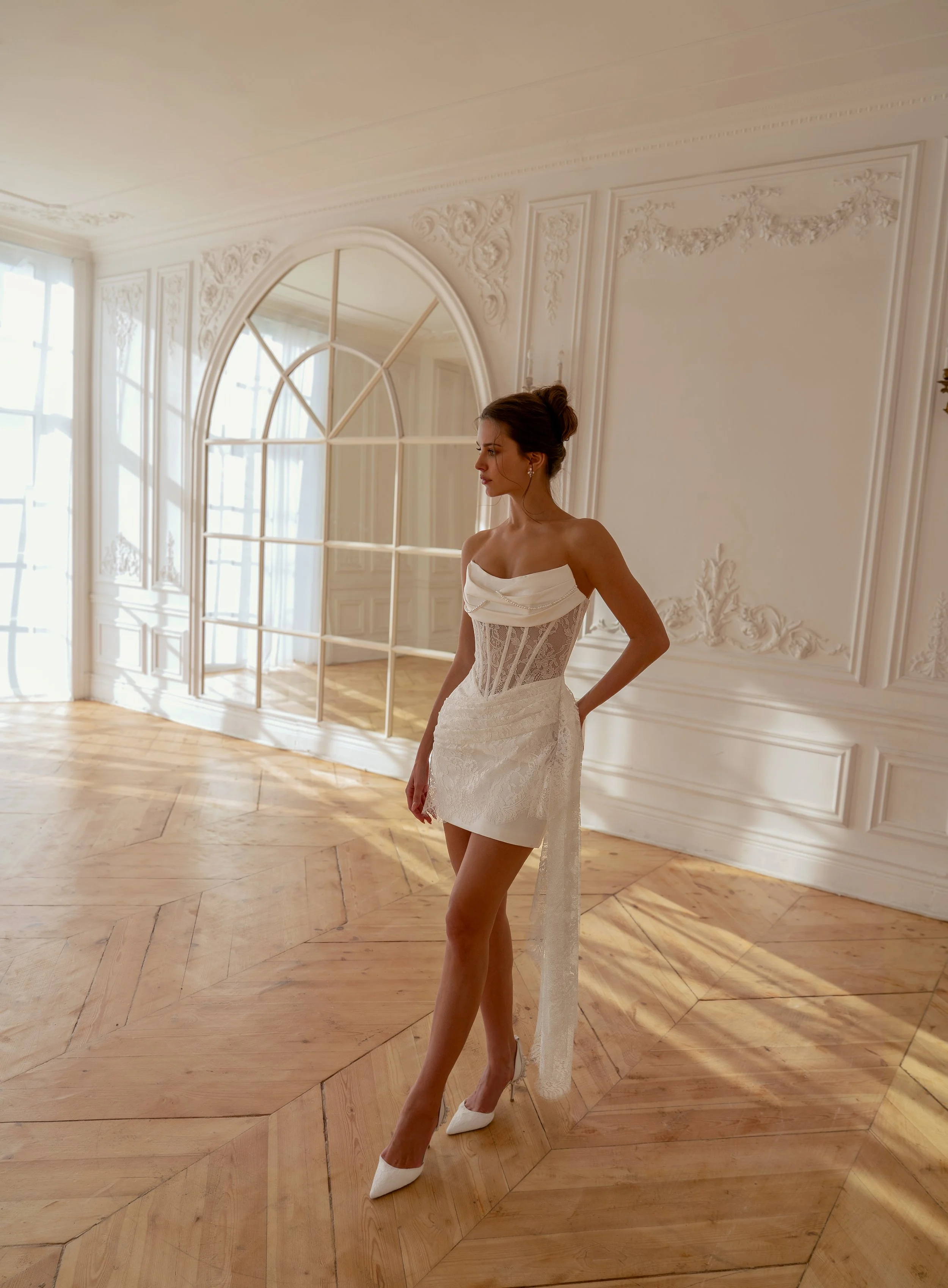 Short wedding dress with basque waist and sculpted neckline side view