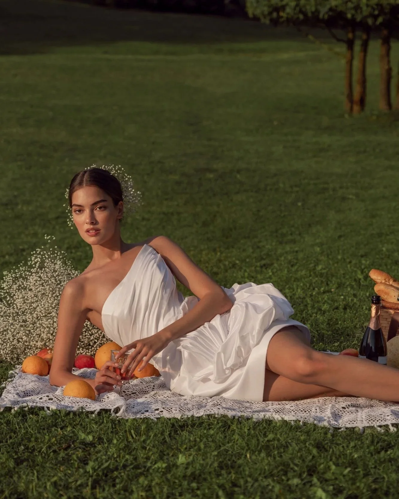 Close-up of the Alessia mini wedding dress skirt, showing the high-fashion floral accent and taffeta fabric.