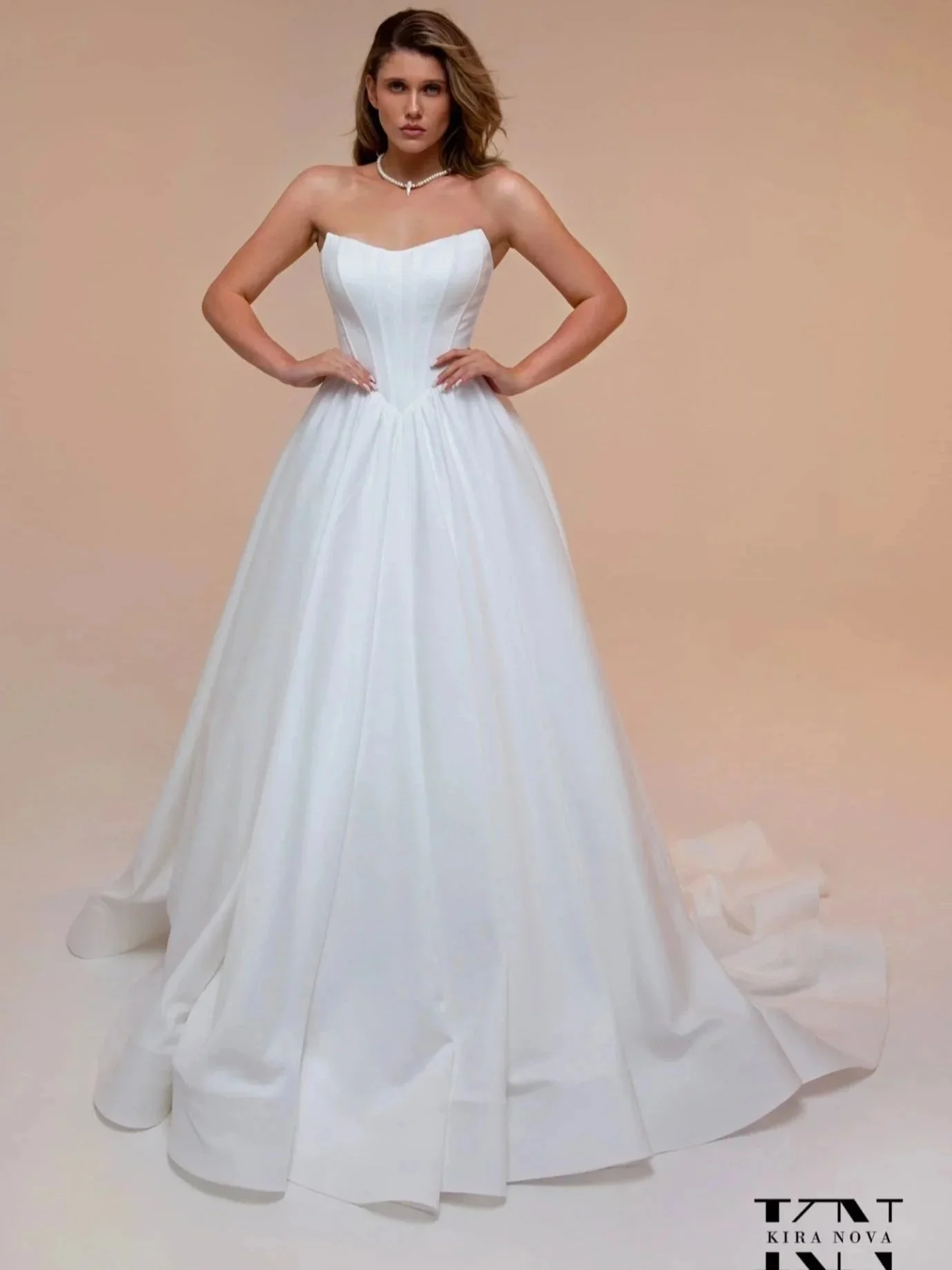 Straples wedding dress Adell by Kira Nova, Ballgown with cat eye nackline and basque waist.