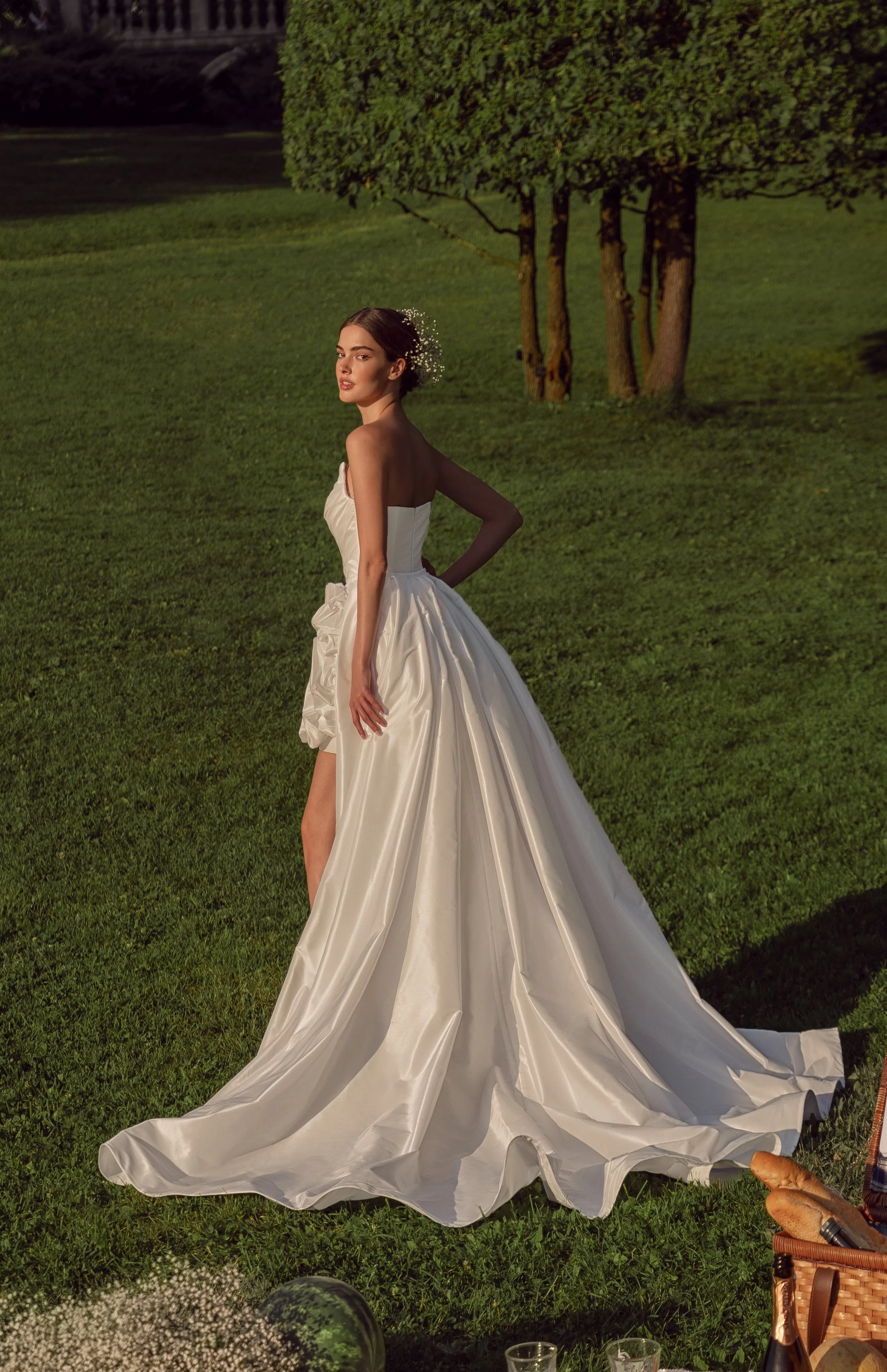 Back view of the Alessia gown in mini form, emphasizing the clean taffeta lines and one-of-a-kind floral detail.