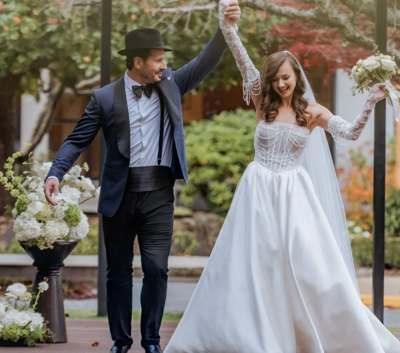 Joyful bride in a satin A-line gown with sheer beaded bodice and cathedral veil, Ethereal Bridal Vancouver