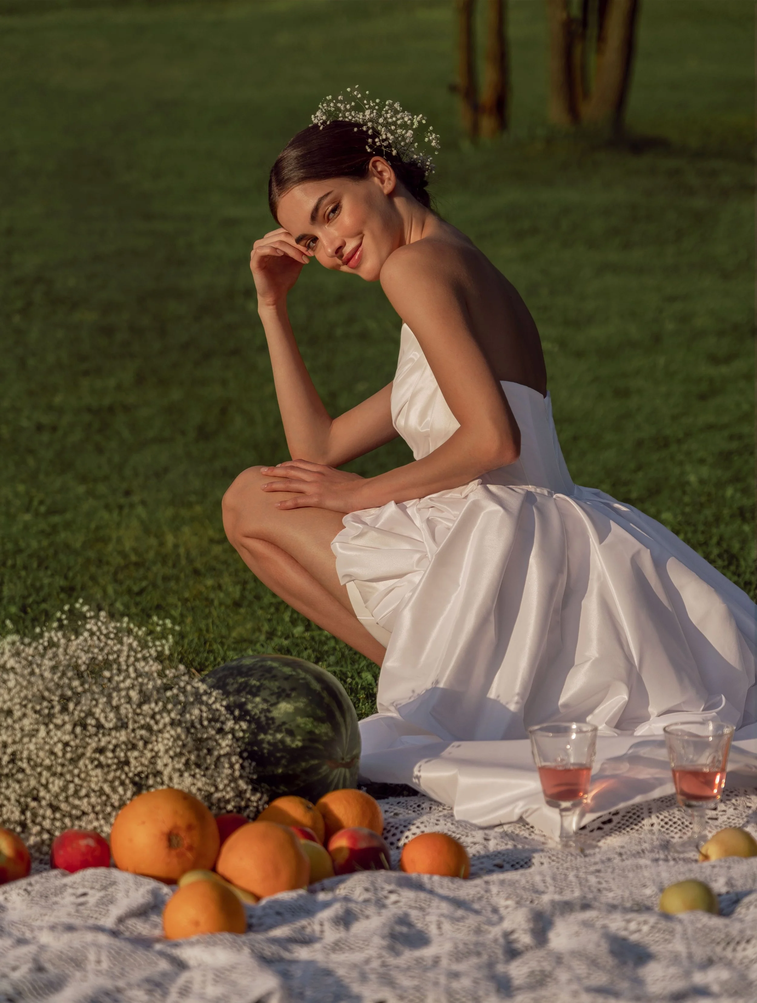 Close-up of the optional taffeta overskirt on the Alessia wedding dress with floral accent.