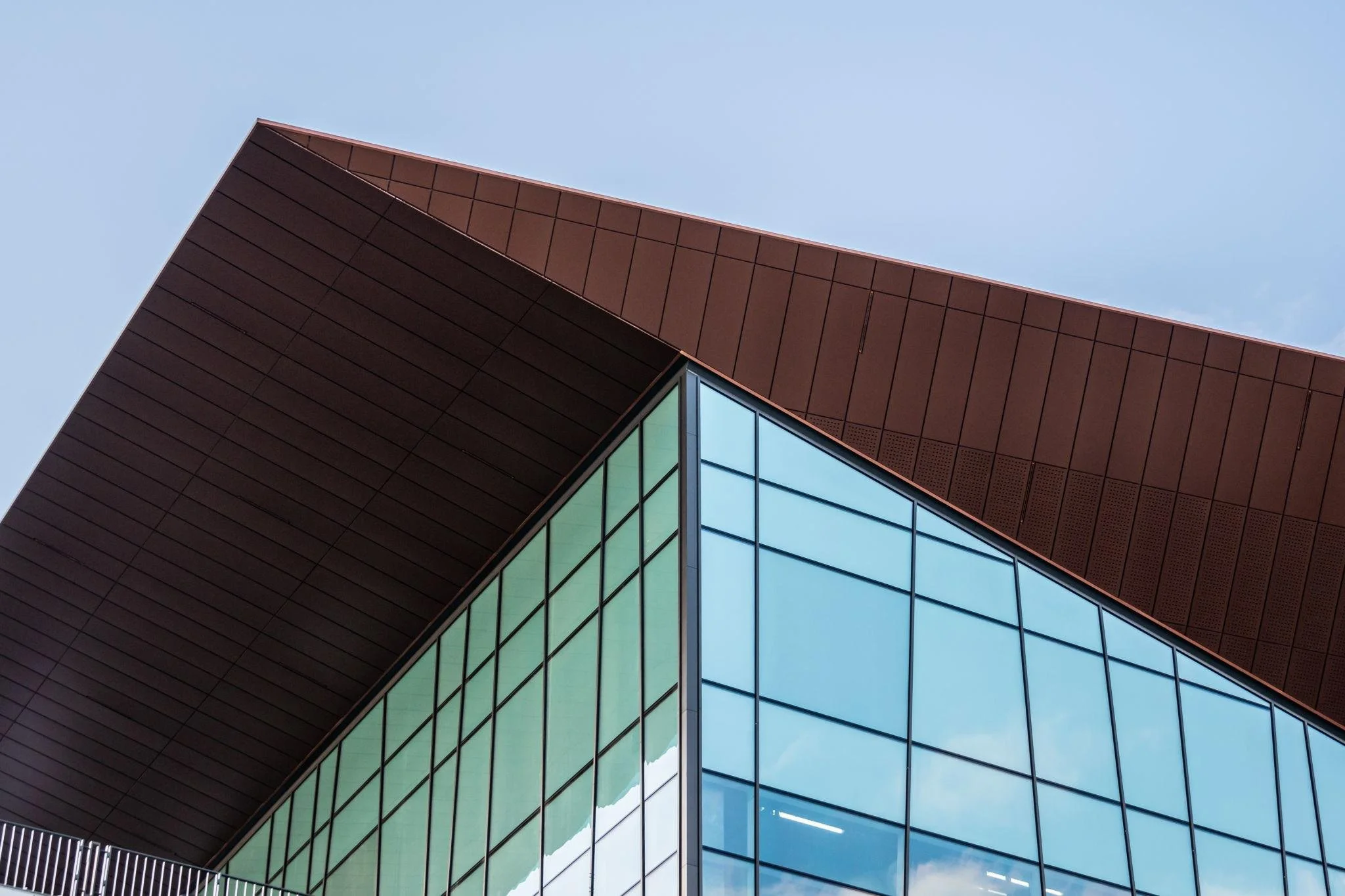 Modern commercial building exterior representing PDC sectors