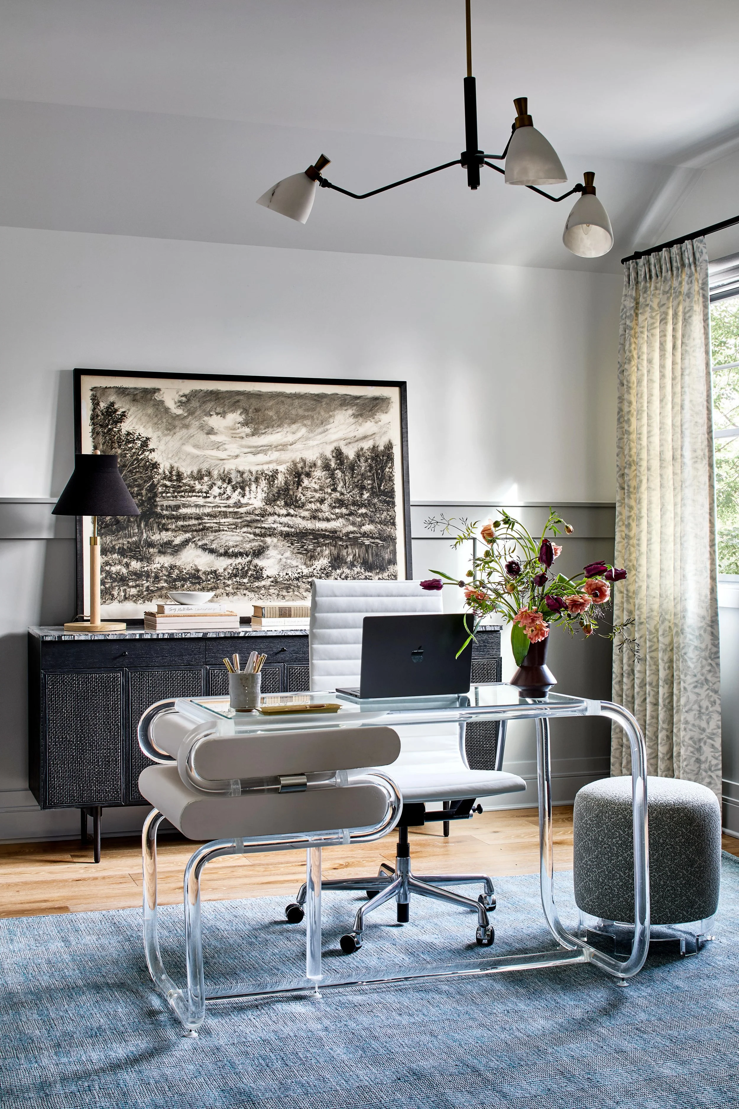 Cool home office with custom millwork and vintage acrylic desk