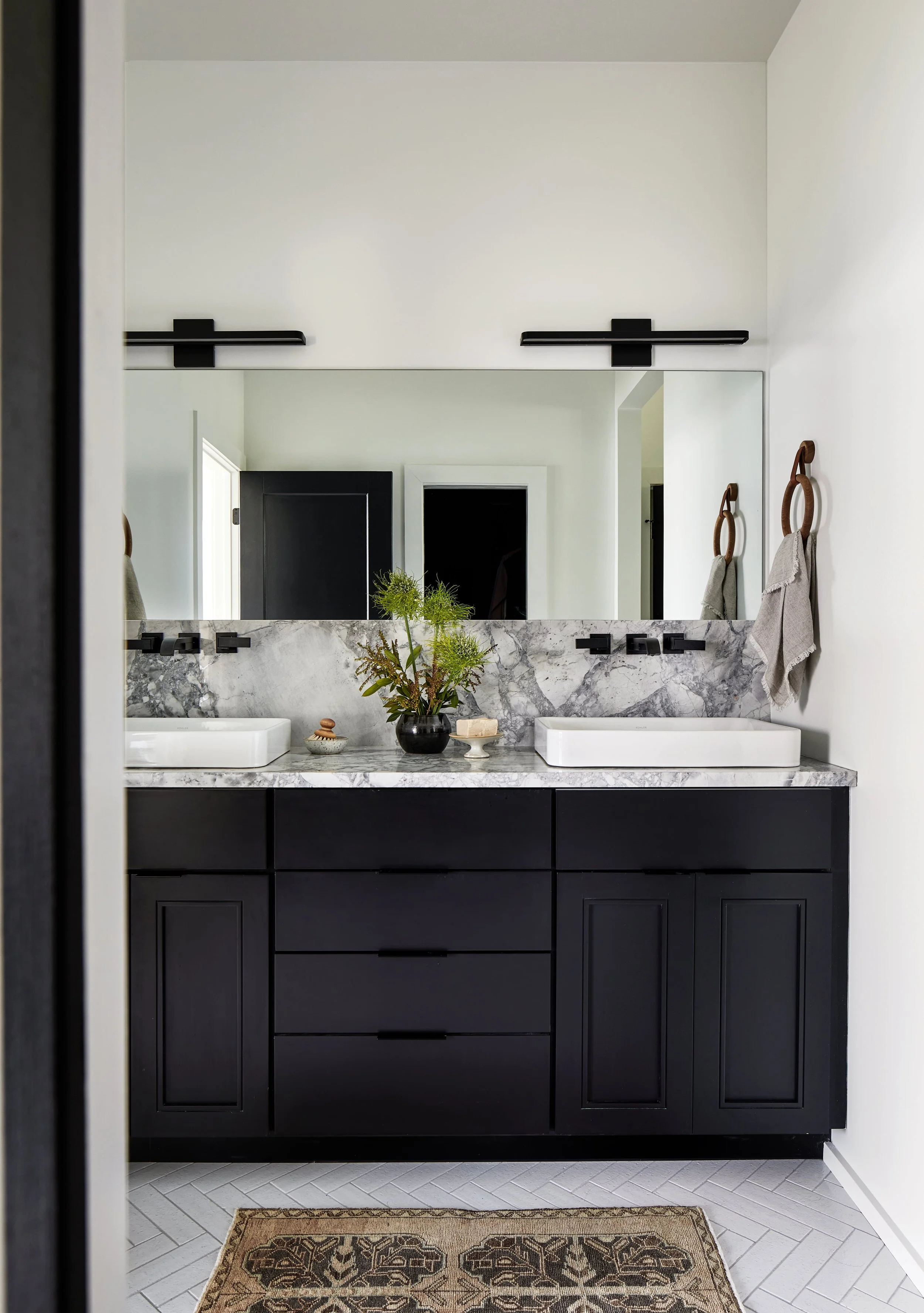 Contemporary bathroom with antique rug