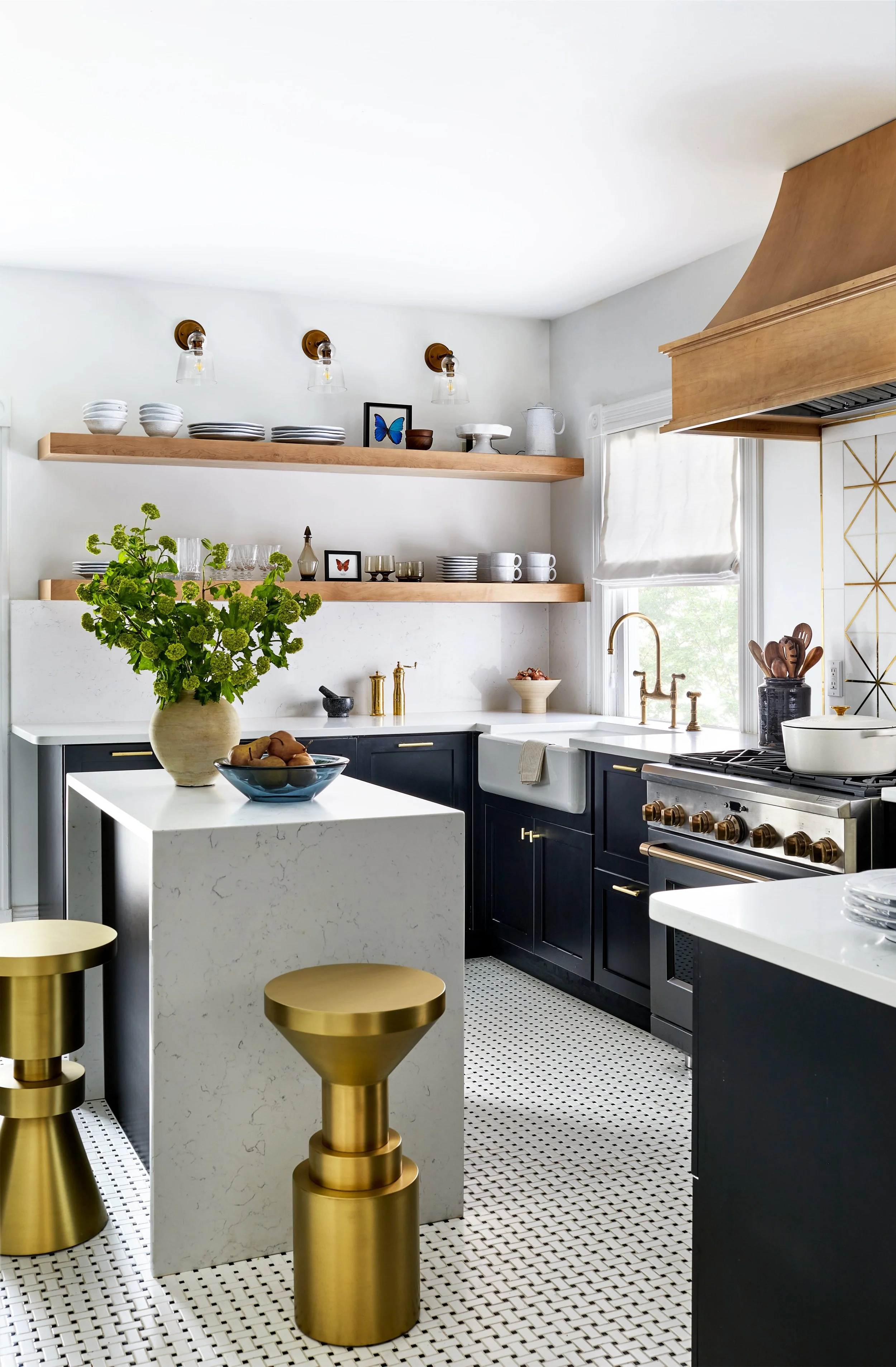 Black and white kitchen with brass accents