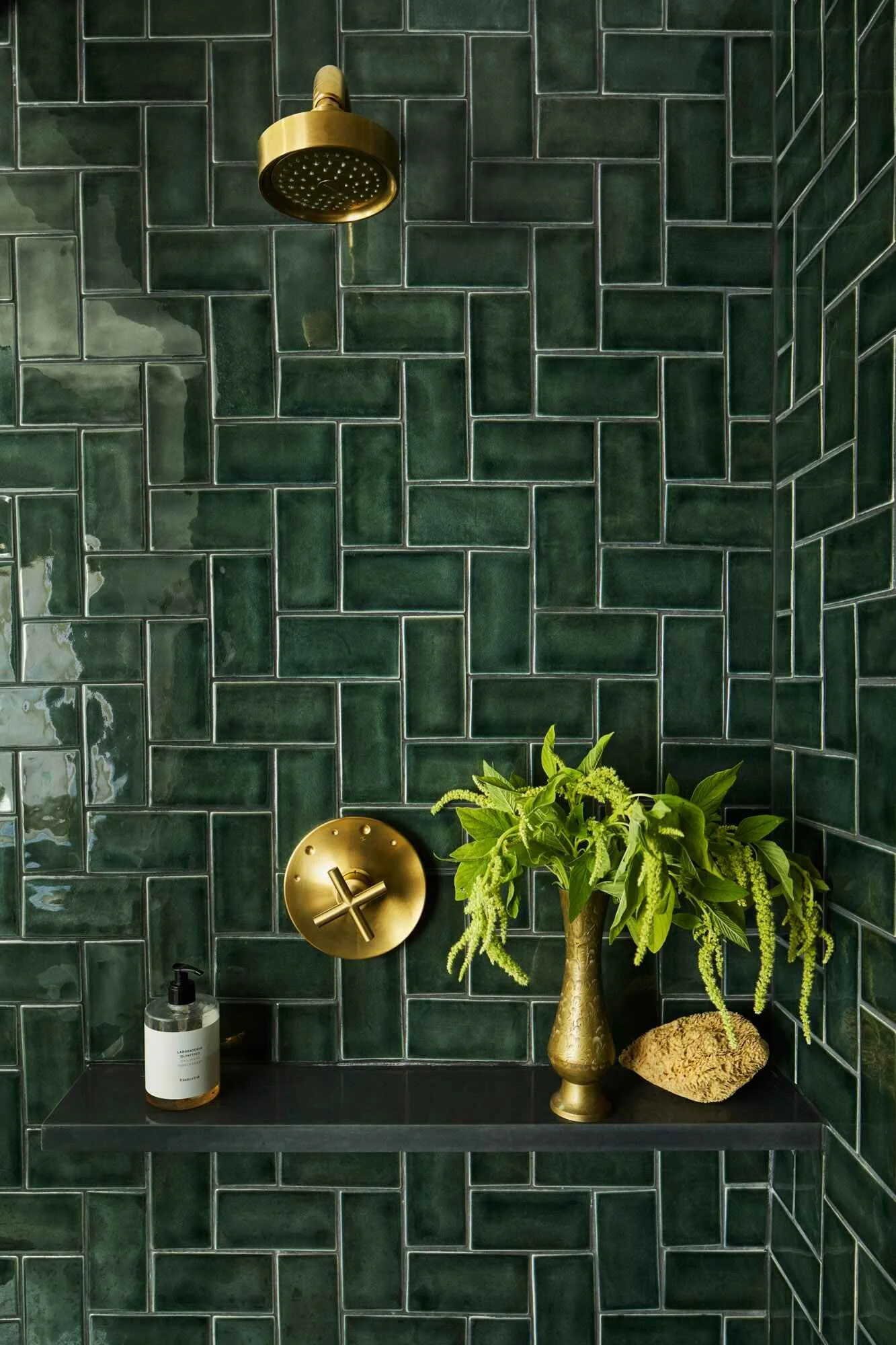 Dark green herringbone tile pattern in Bethesda Maryland bathroom design