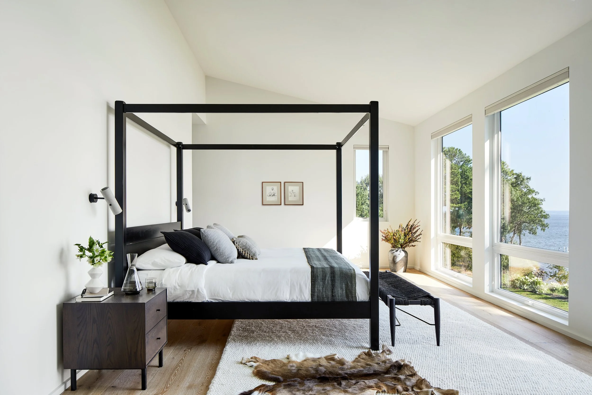 Black canopy bed in simple modern architecture