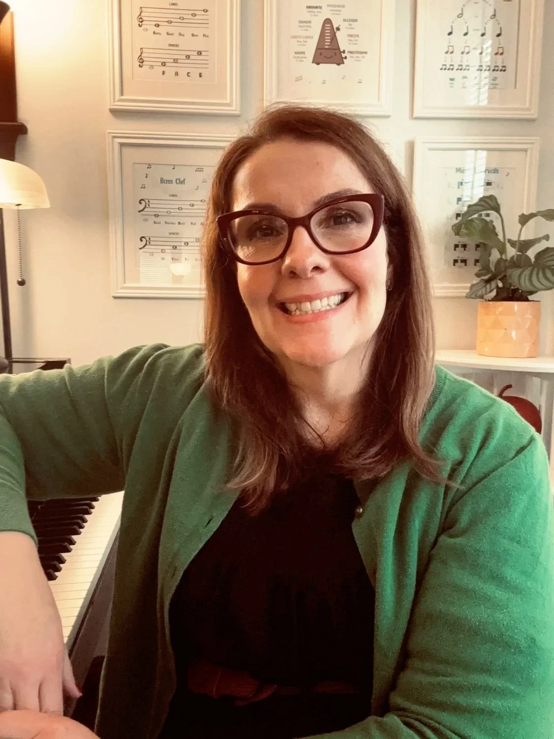 Katie Jillson, white female, at piano, offering Voice lessons for adults, kids & creative musicians in Boston, MA.