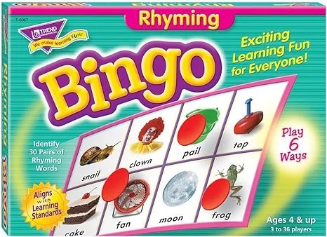 Bingo game set featuring rhyming words with images of a snail, clown, pail, top, cake, fan, moon, and frog, designed for children aged 4 and up.
