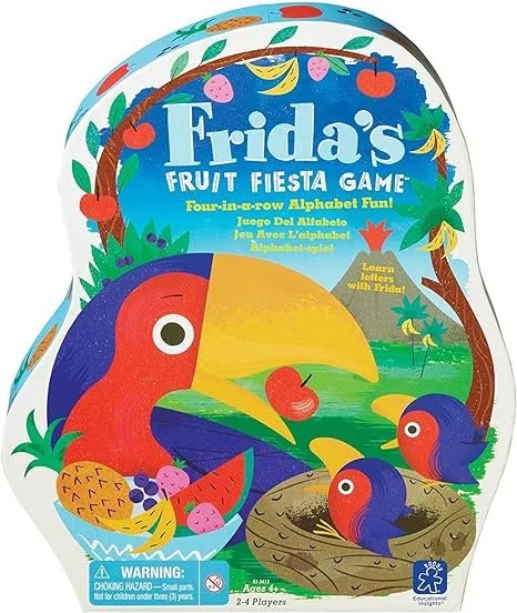 Box for 'Frida's Fruit Fiesta Game' featuring colorful toucans, fruits like pineapples, berries, banana, and watermelon, with a lush jungle background and trees. Contains text about the game and a warning label.