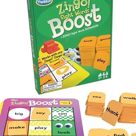 Box of ThinkFun Zingo Sight Words Boost game with stacks of orange word tiles including words like "look," "good," "play," "thank," "see," "walk," and "find."