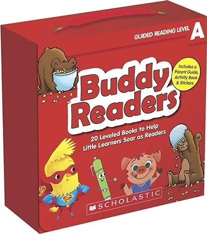 Red educational box of Buddy Readers guided reading level A books with cartoon animals, including a bear, a pig, a bird wearing glasses, and a green crayon, from Scholastic.