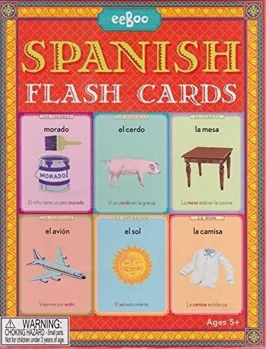 Spanish flash cards displaying words and images for morado (purple), el cerdo (pig), la mesa (table), el avión (airplane), el sol (sun), and la camisa (shirt).