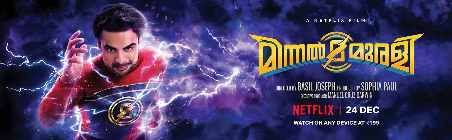 A promotional poster for the Netflix film Minnal Murali, showing actor Tovino Thomas in a superhero costume with lightning effects around him, set against a stormy background.