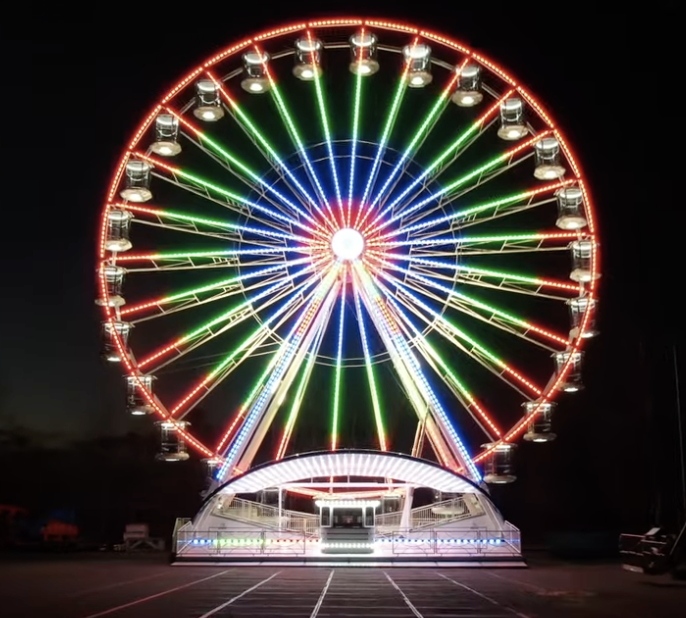 Giant Wheel by Carnival Amusements with lights