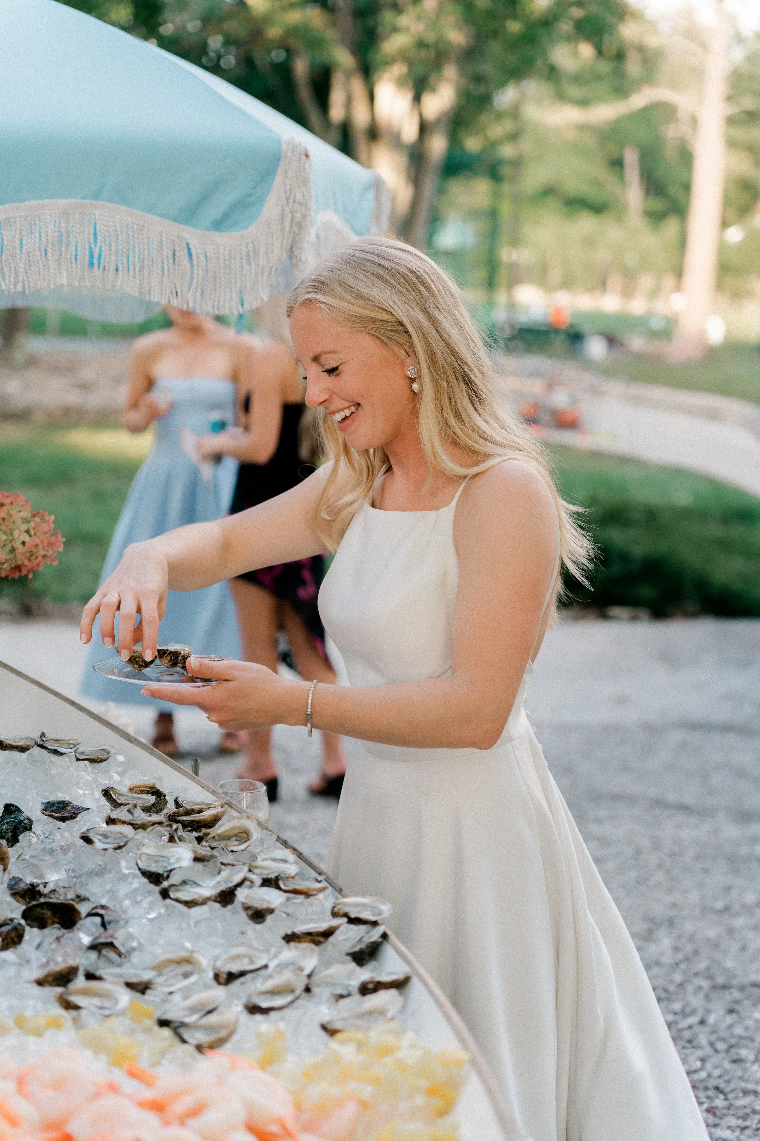 bride and groom at wedding raw bar