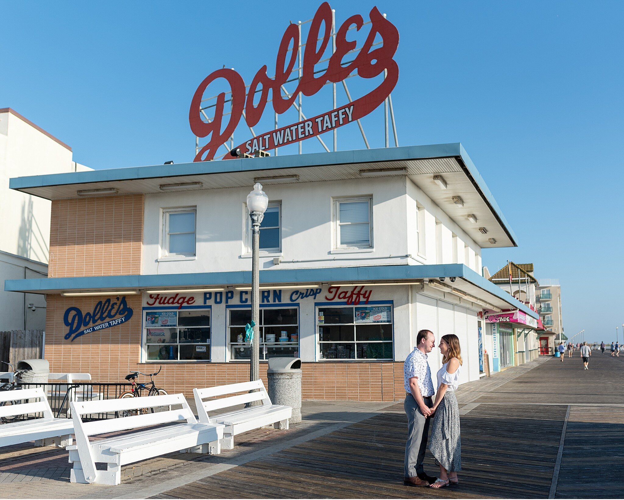 Dolles Rehoboth beach boardwalk engagement session