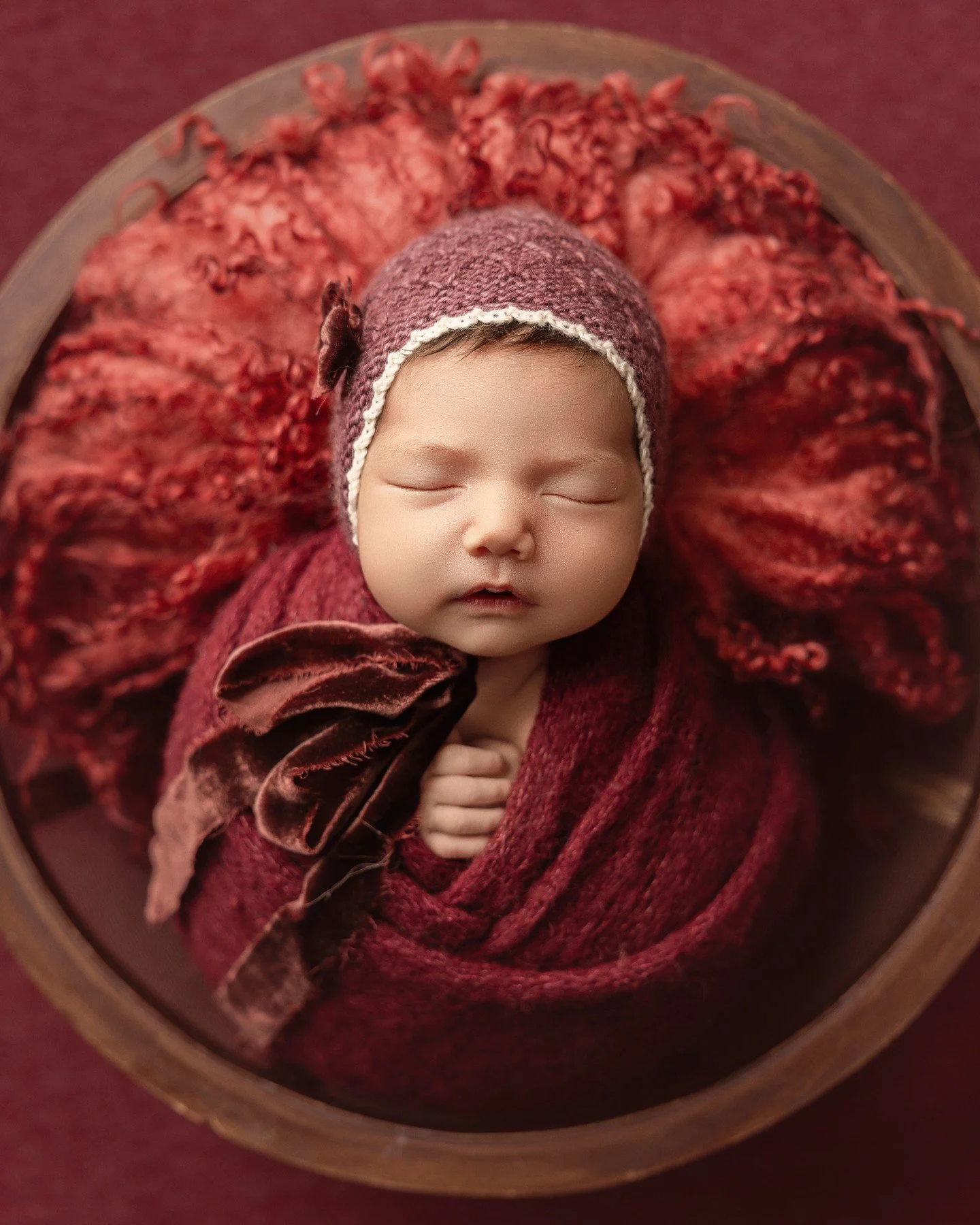 This little princess had so much hair, she looked just like Snow White! So apple red matched her complexion beautifully! I love when parents choose colour for their newborn photoshoot and her stunning mommy chose red, lilac &amp; pink for her set ups