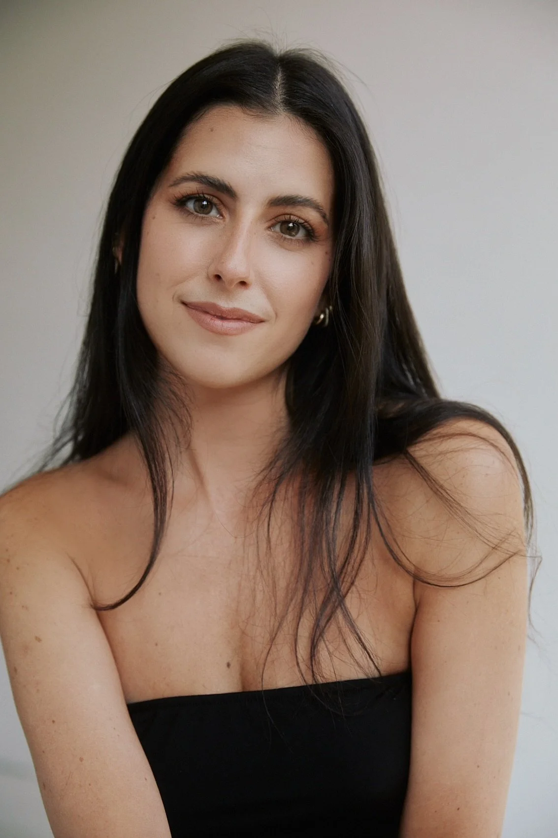 Sydney Halela, Brooklyn based ceramic artist and painter, portrait on neutral background