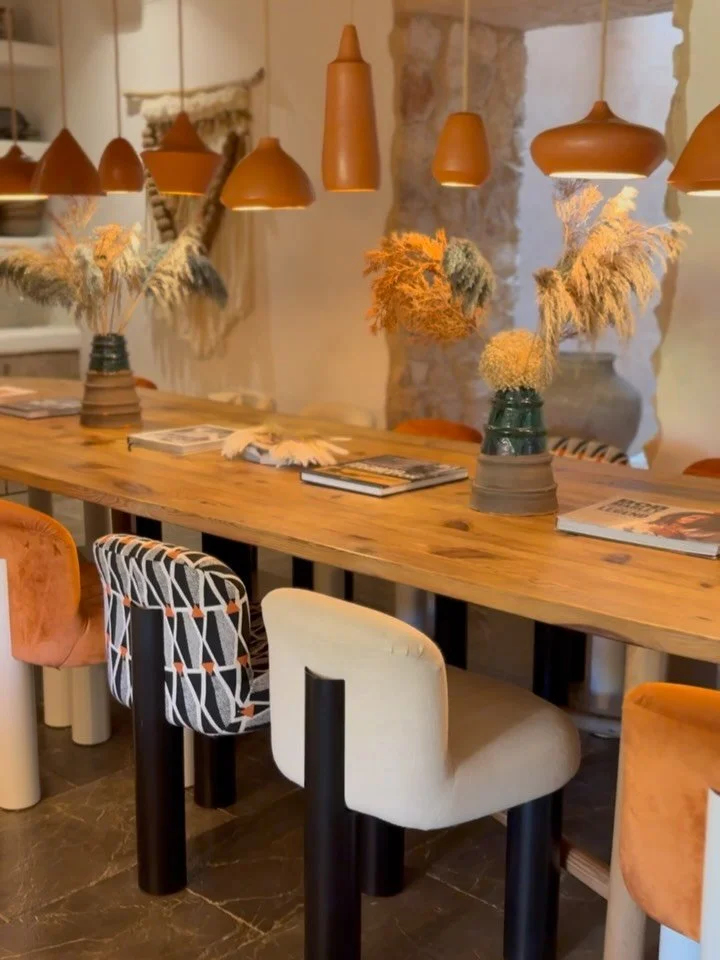 A table to tell stories around. 

Crafted from wood and surrounded by curated textures, this 18-seat centrepiece at Fincadelica invites long, lingering breakfasts, candlelit conversations, and soul-nourishing meals in every season.

To explore the wh