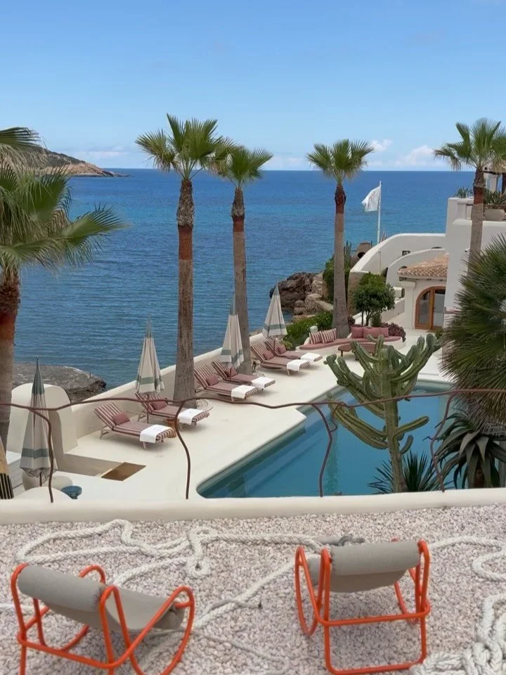 At Fincadelica Xarraca the panoramic pool deck is flanked by arched bathing cabanas furnished with circular Royal Botania beds. 

A Loro Piana striped theme runs throughout, adding a touch of vintage Slim Aarons seaside glamour, while an elevated coc