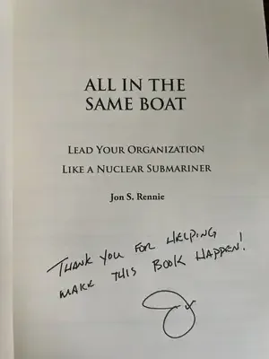 Open book with handwritten thank you note and signature on the title page. The note reads, 'Thank you for helping make this book happen!'