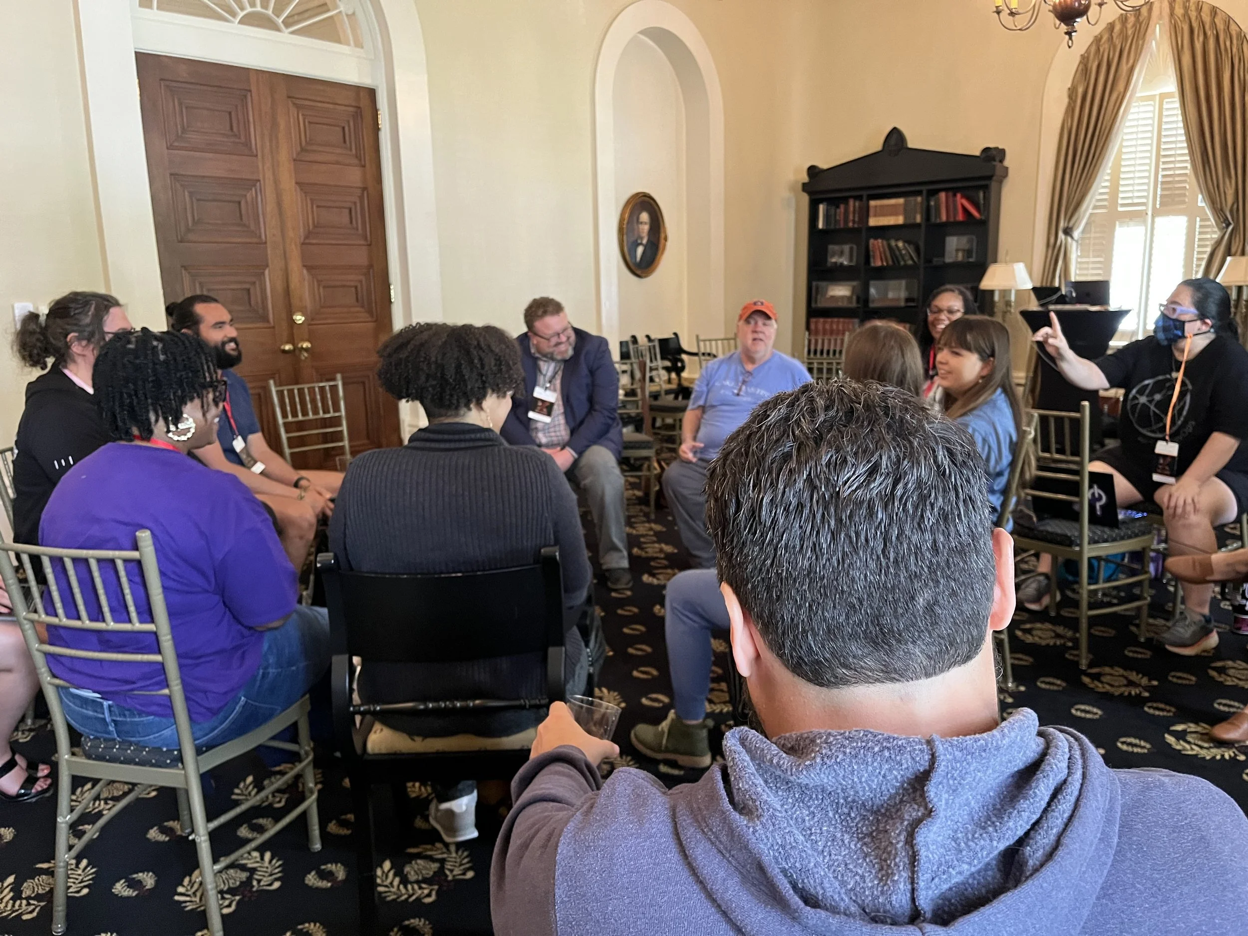 Business book ghostwriter Derek Lewis and author John Willis leading a panel discussion circle on how to write a business book at DevOps Days Atlanta 2025.