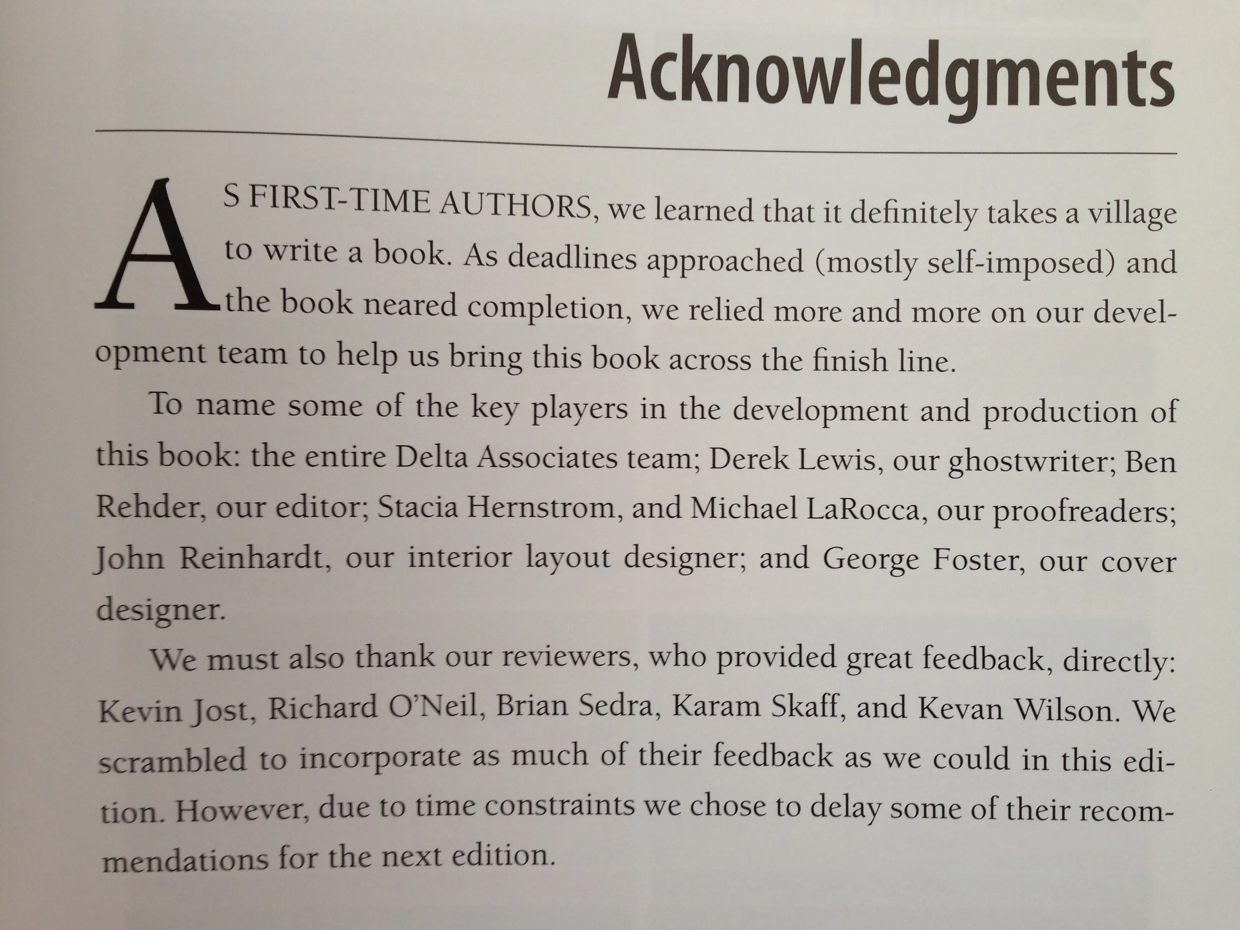 A page from a book titled "Acknowledgments," with a large capital letter A at the beginning of the text, thanking various team members and reviewers involved in the book's development.