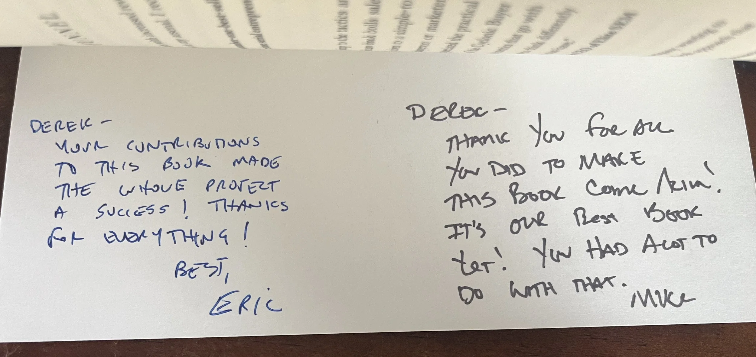 Two handwritten notes on separate sheets of paper. The note on the left is written in blue ink and thanks Derek for contributions to a book project, signed by Eric. The note on the right is written in black ink, thanking Derek for making the book come alive and noting it is their best book, signed by Mike.