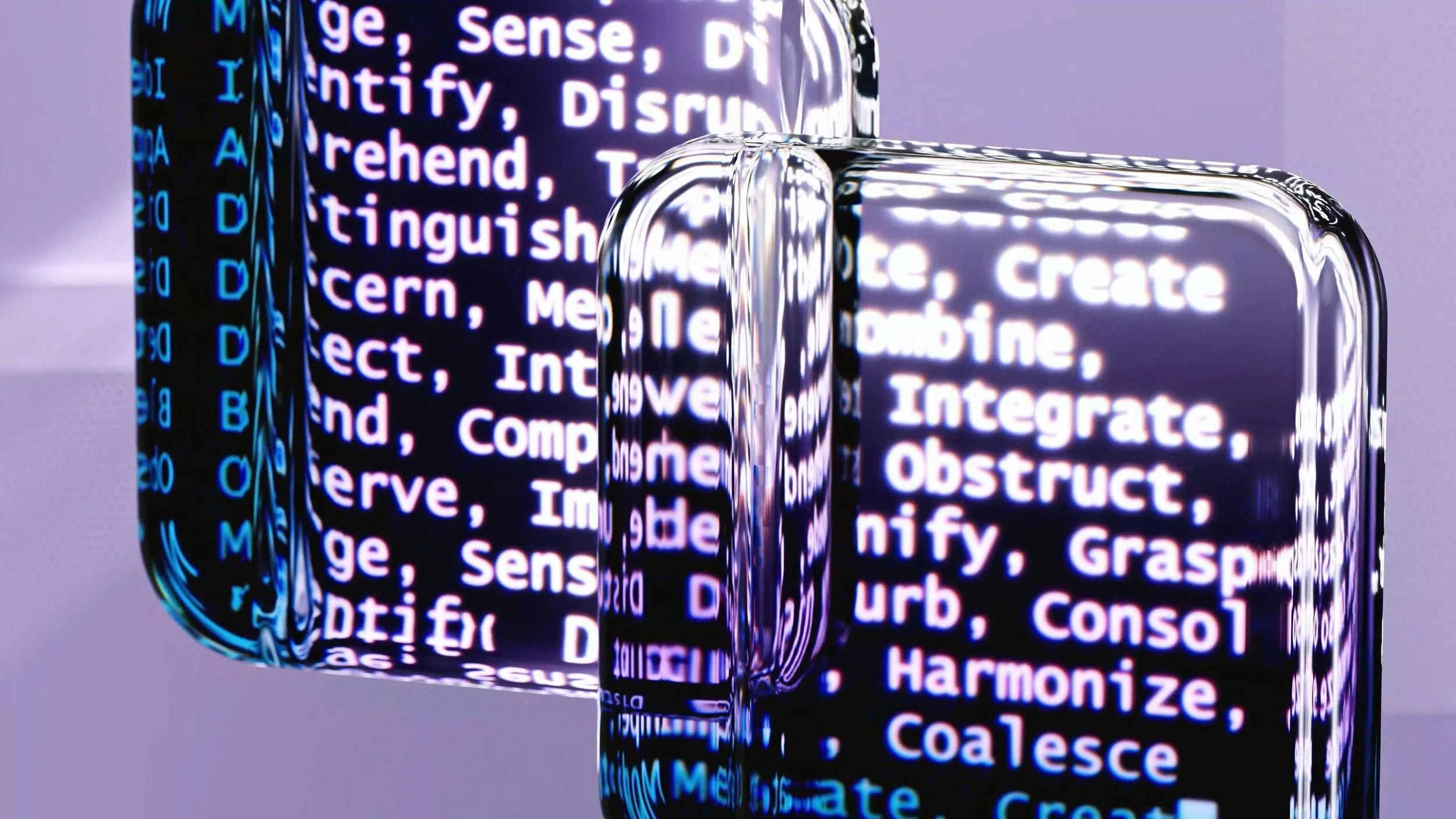 Close-up of reflective, metallic, cube-shaped sculpture with digital code and programming language text on its surface.