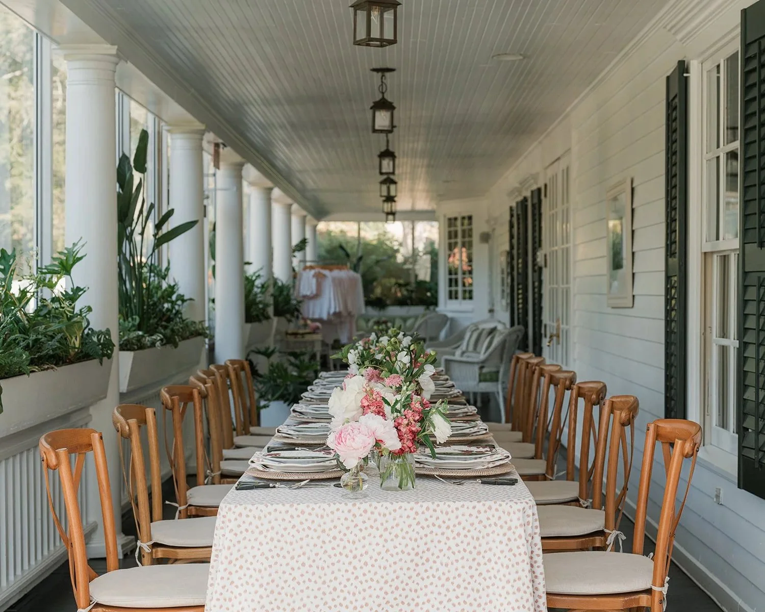  the bridal party luncheon is set on the porch at the Mayflower Inn  