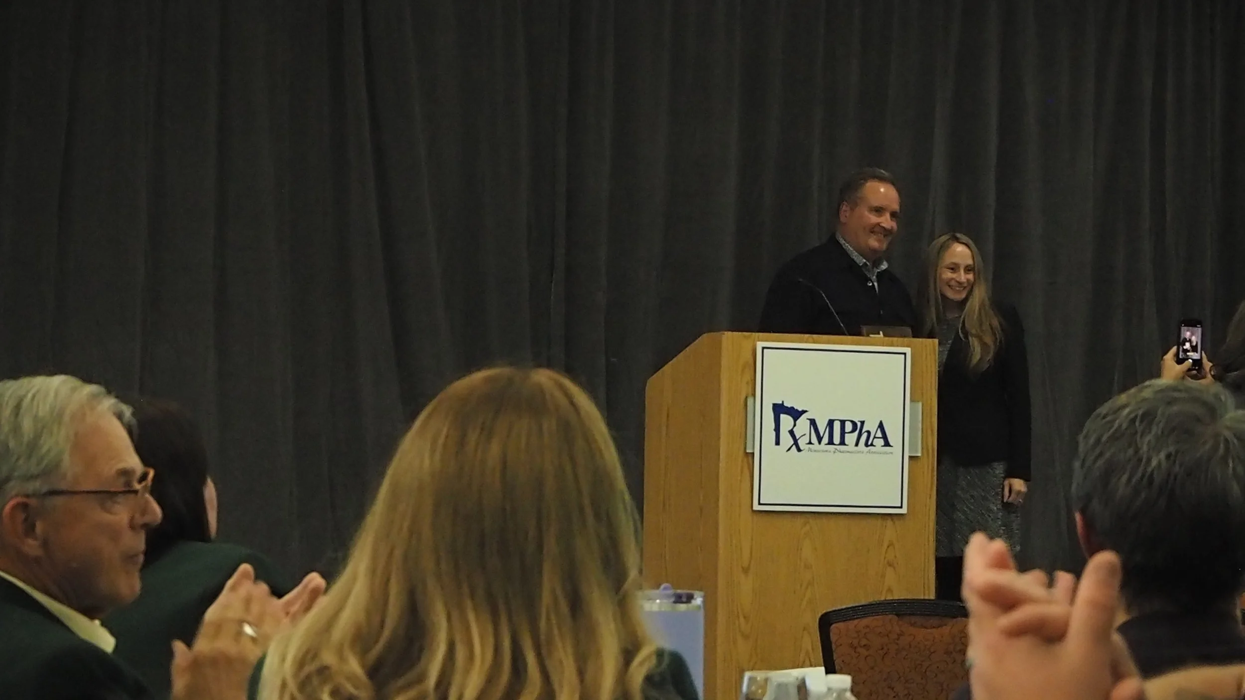 John Hoeschen accepts his 2025 Harold C. Popp Award from the Minnesota Pharmacists Association (MPhA)