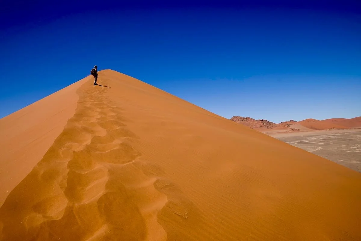 Being here in Namibia's Namib Desert feels surreal&mdash;an ancient sea of sand sculpted by wind and light. As one of the driest and least populated places on Earth, it is both extreme and otherwordly. The iconic dunes of Sossusvlei, some among the h