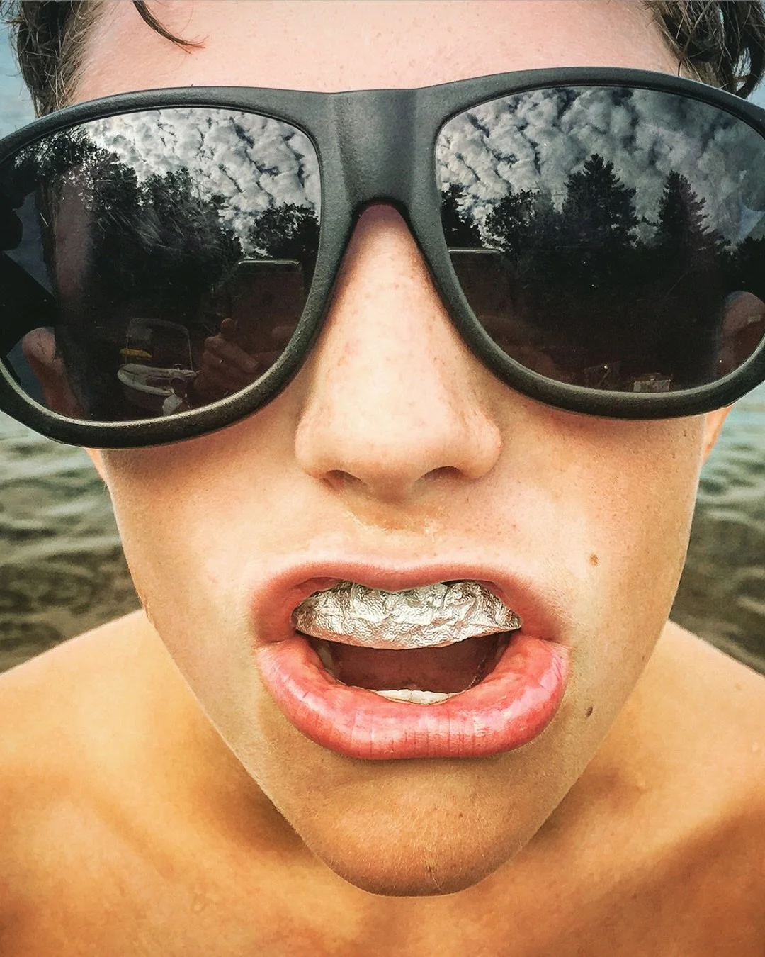 📷 Memory in Moment Exhibit
&ldquo;Summer Grill&rdquo; by Babs Wheelden @babswheelden 

A split second of heat and reflection &mdash; mirrored clouds, salt on skin, and a flash of metallic shine that turns an ordinary summer instant into something un