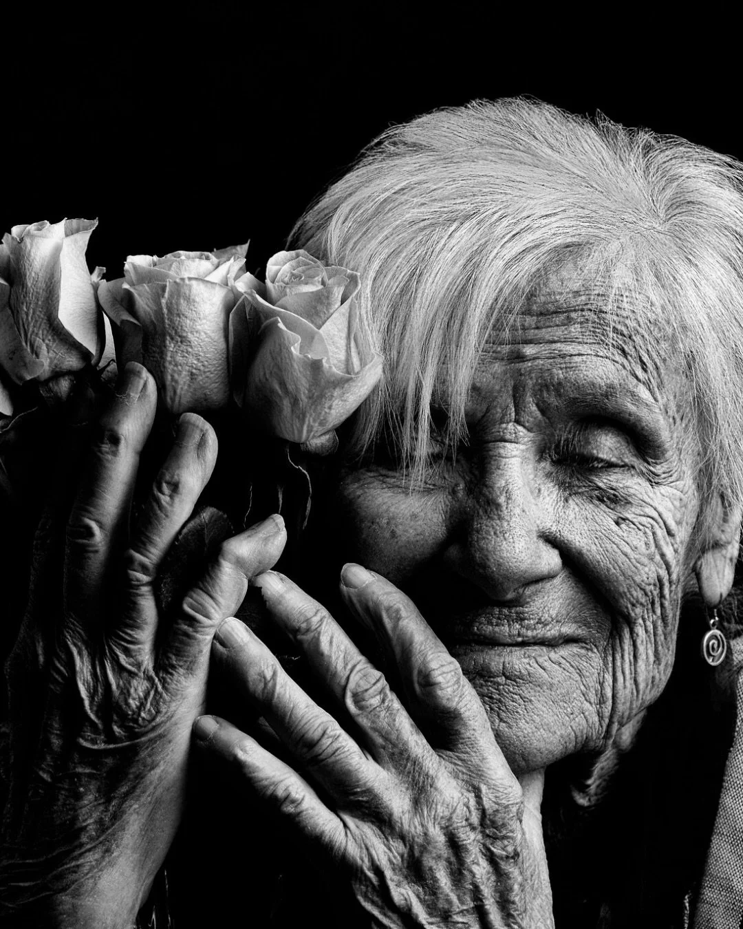 📷 Memory in Moment exhibit
First Place &mdash; &ldquo;Last Days&rdquo; by Hal Kahn

A quiet communion between skin and petals &mdash; time etched into hands, tenderness lingering where memory breathes its final warmth.

🖤 Our new call for entry is 