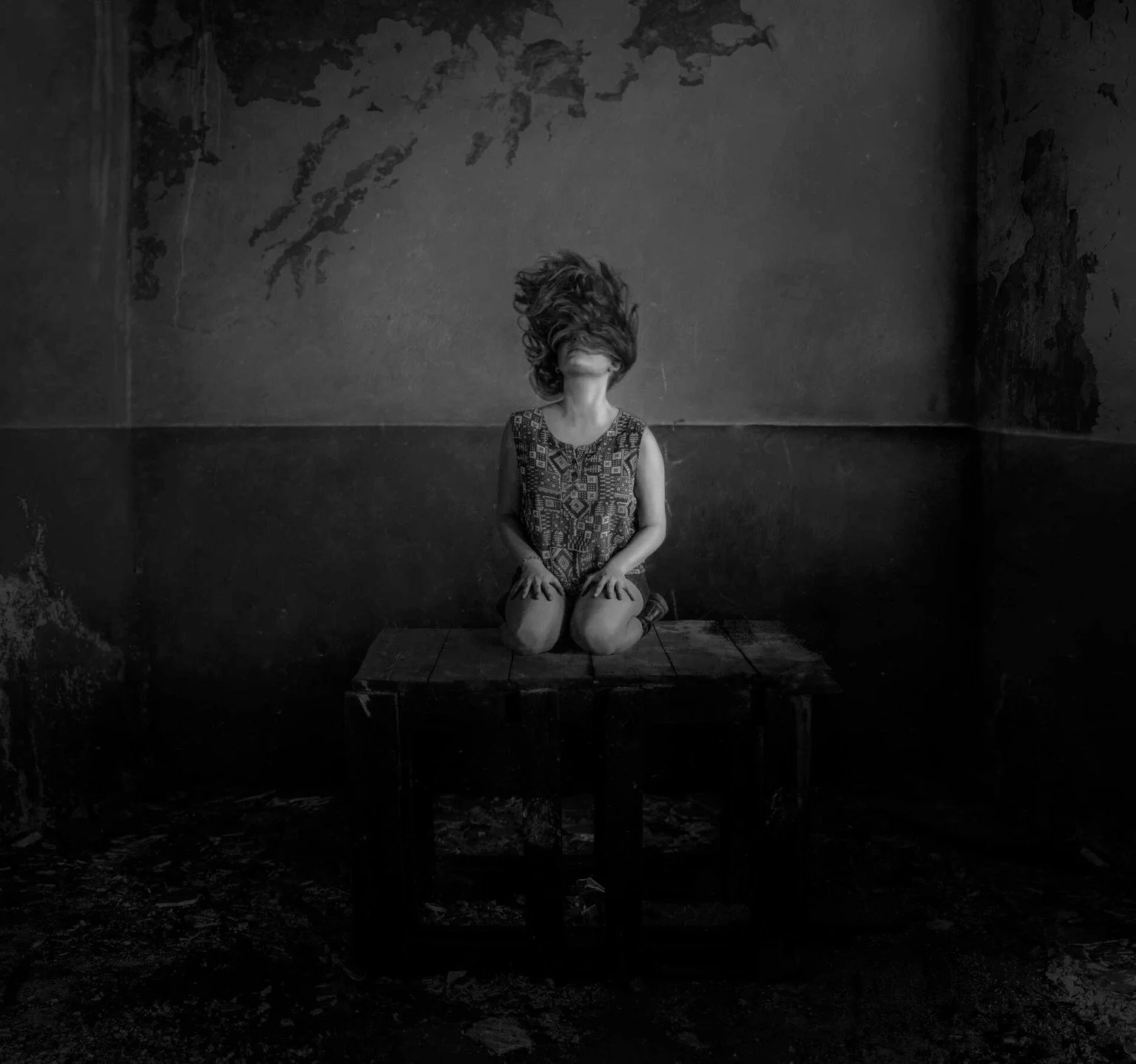 📷 B&amp;W: The Poetry of Light &amp; Shadow
&ldquo;Suspension&rdquo; by Hector Abela @hectorabela 

A solitary figure kneels in a decaying room, her hair lifted as if by an unseen force. The body remains still while the moment feels suspended betwee