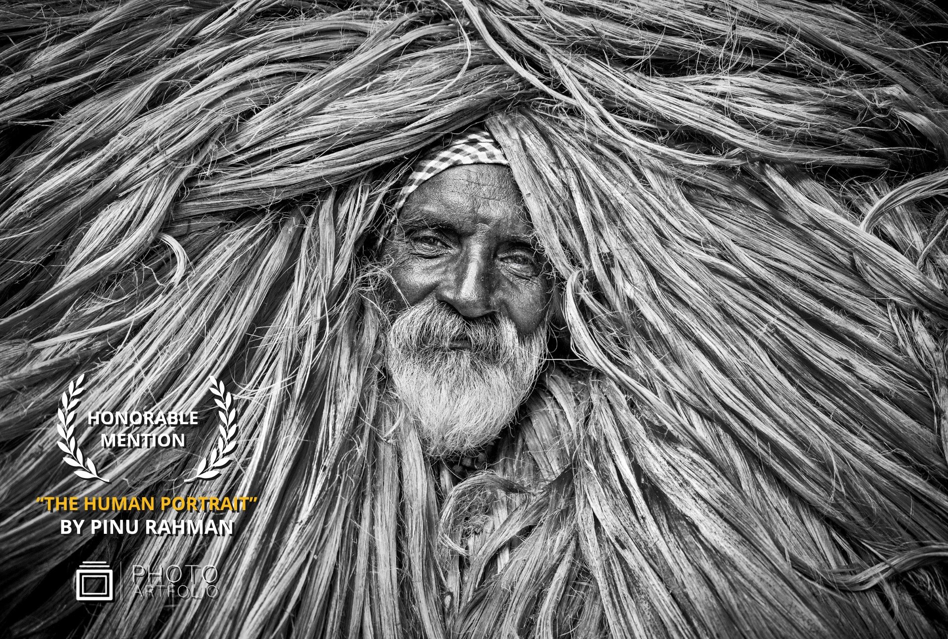 📷 THE HUMAN PORTRAIT
Honorable Mention
&ldquo;Threads of Life&rdquo; by Pinu Rahman (@pinu.bd)

A face shaped by time.
A presence woven into texture, memory, and labor.

The strands that surround him feel like an extension of his story&hellip; threa