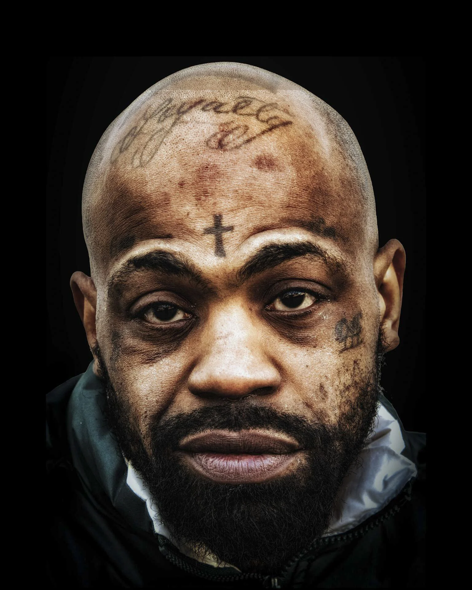 "Man with Crucifix Tattoo" by Andrew Wohl