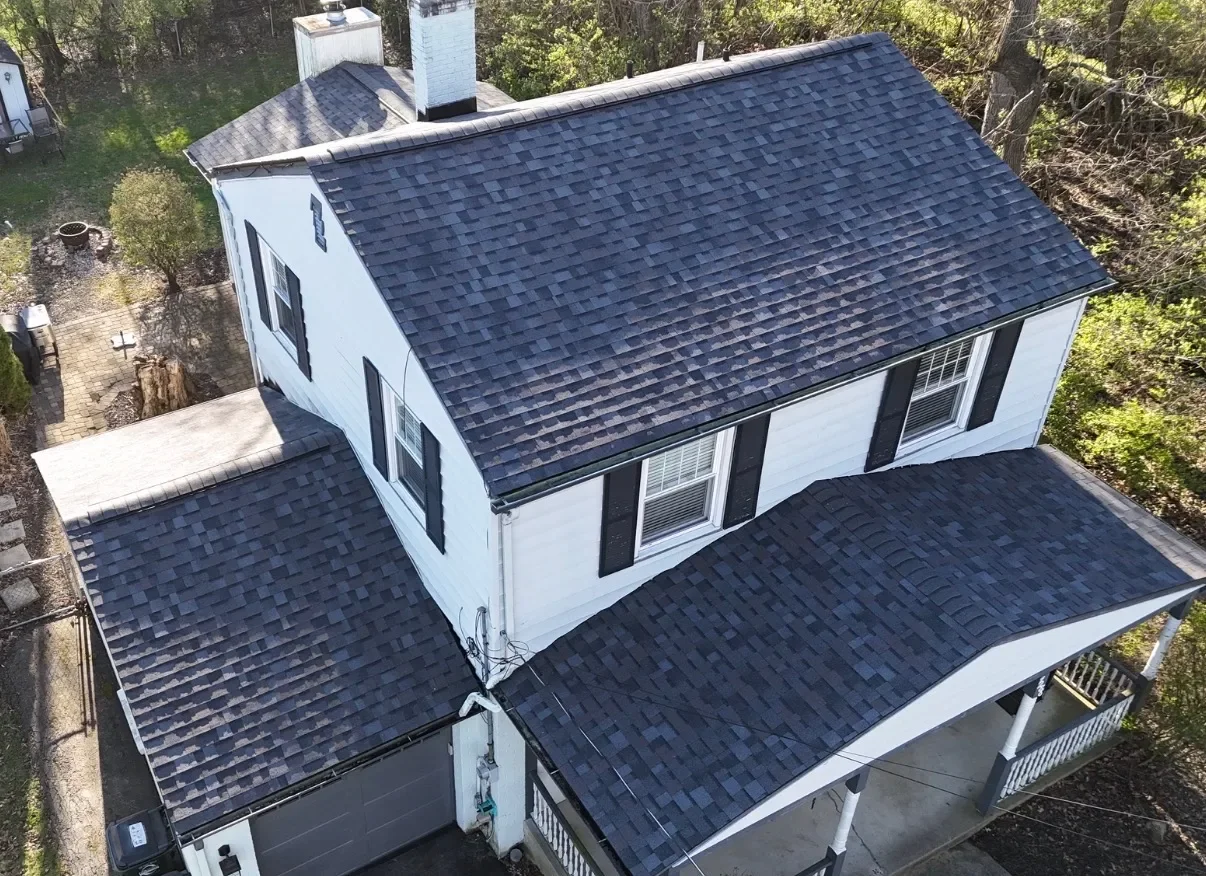 A new roof installed by Riegler Contracting after a large tree branch fell through their old one.