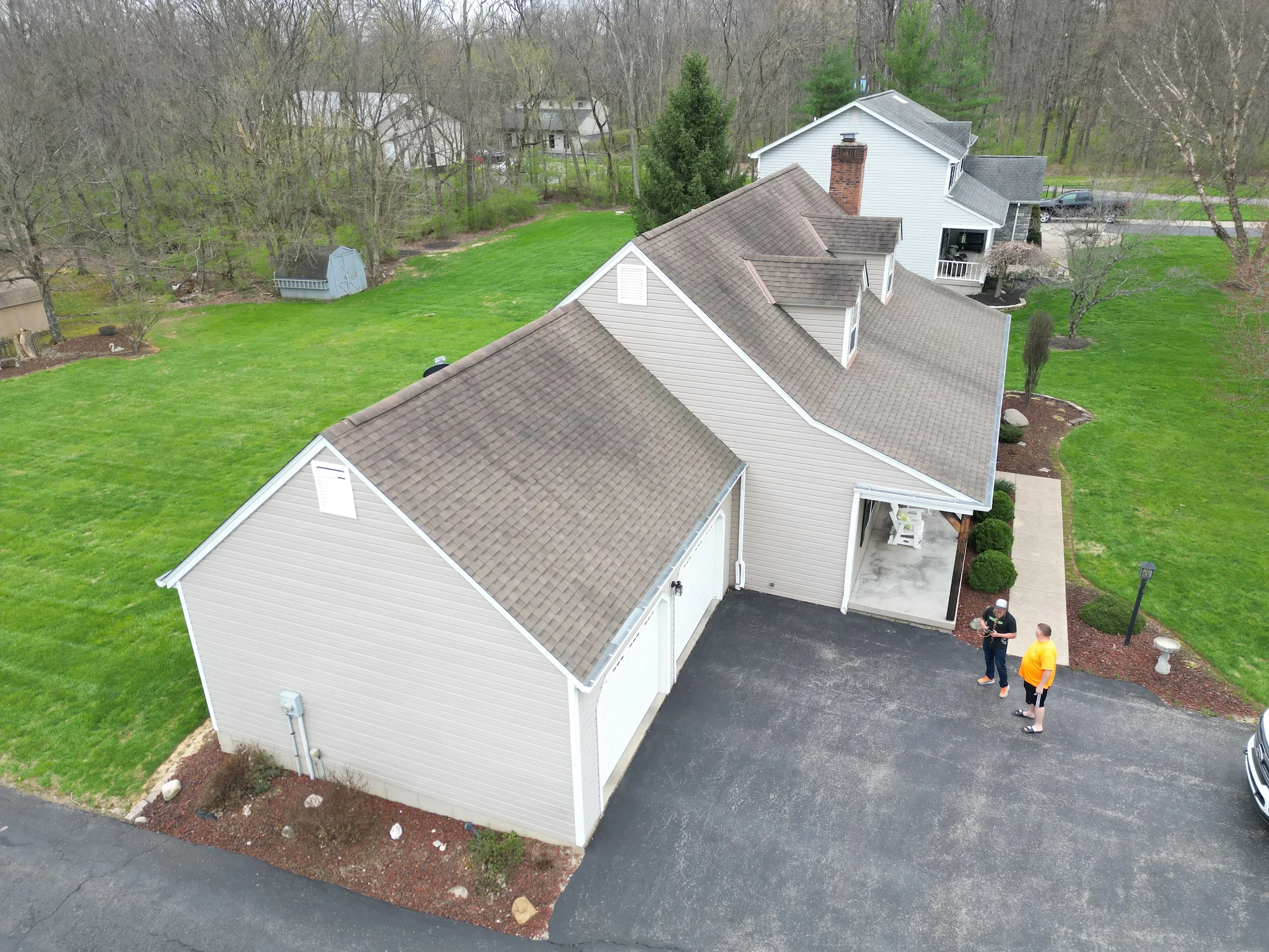 An aerial view of a home's roof that is being inspected by Riegler Contracting.