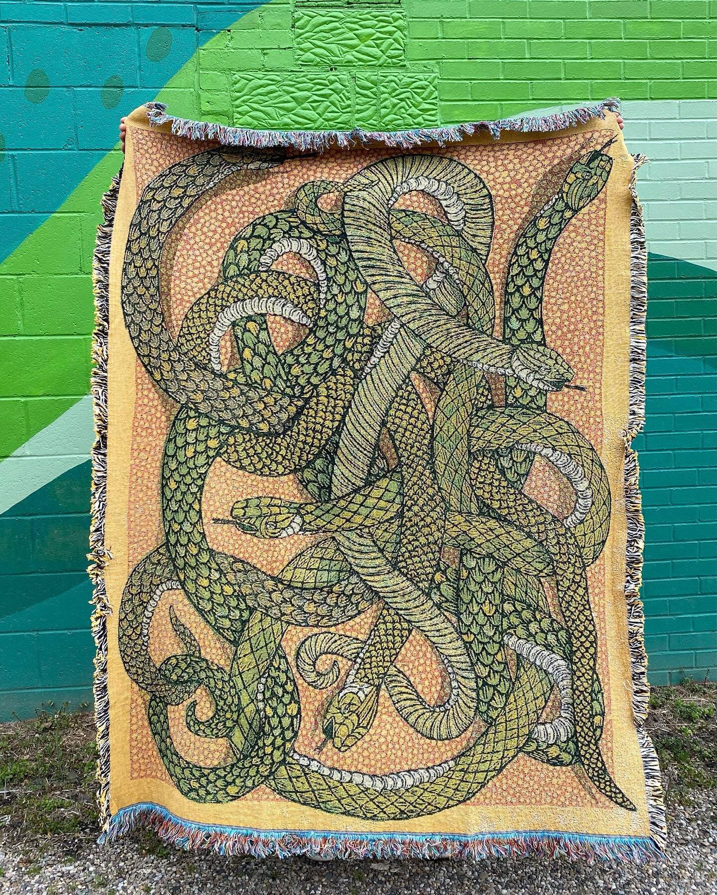 Have you always dreamed of cuddling up on the couch with a big cozy pile of snakes? If so, we got you covered. 
This cotton snake throw blanket was machine woven from one of our woodcut prints. It measure 72&quot; x 54&quot; and was made in the USA. 