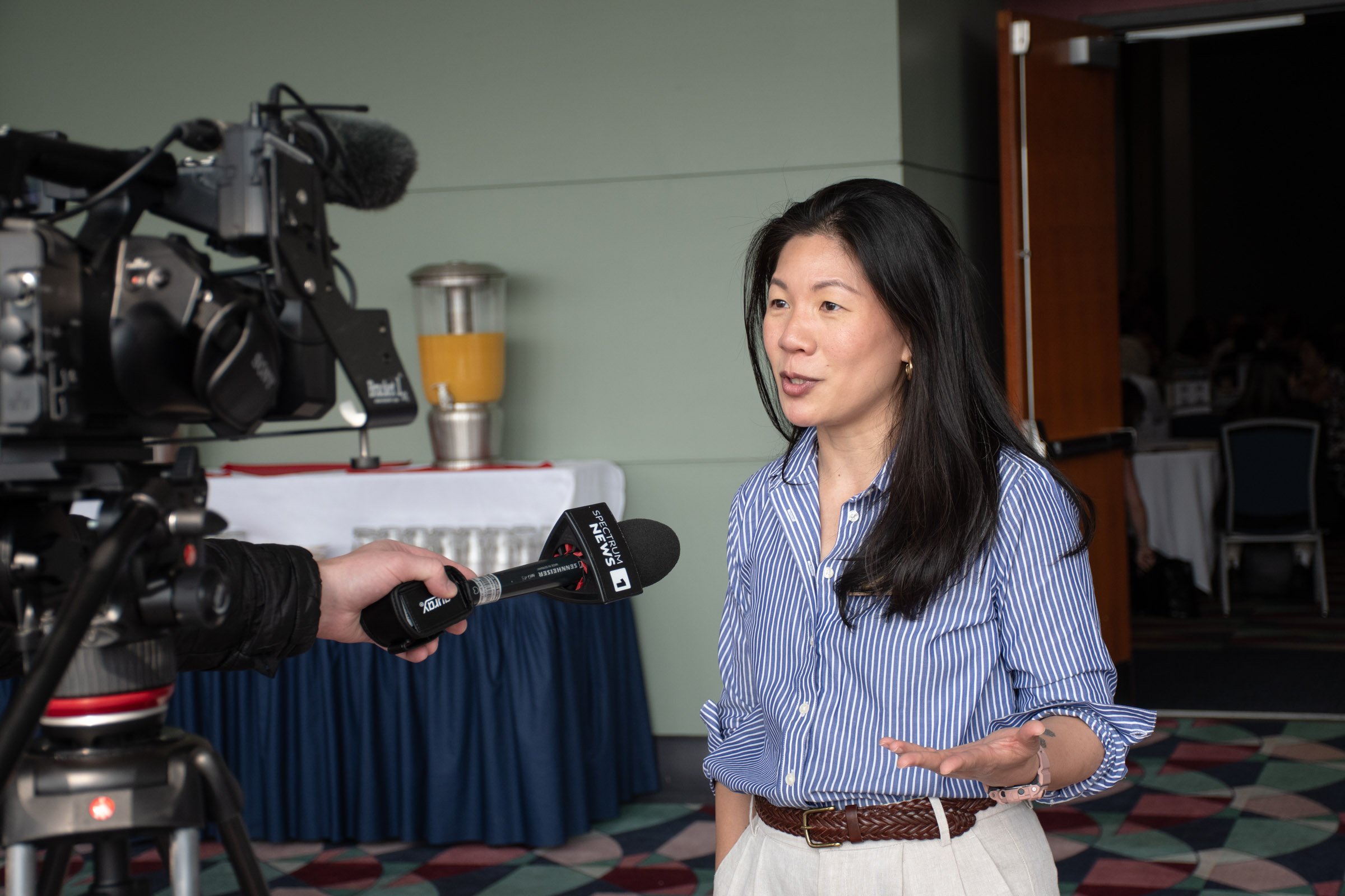 Director of Community Assistance Christine Madore discusses the team’s goals with a reporter.