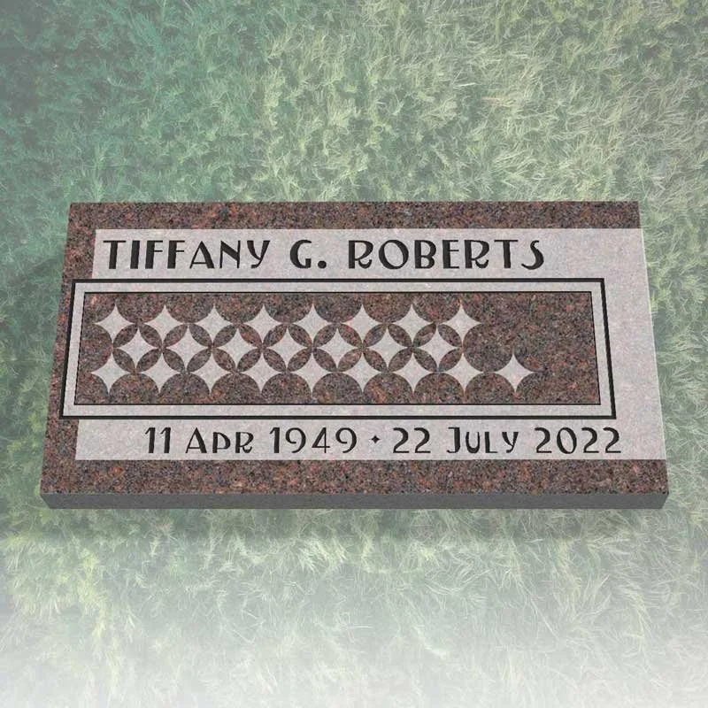 Granite memorial plaque for Tiffany G. Roberts with birth date April 11, 1949 and death date July 22, 2022, featuring a decorative geometric pattern.