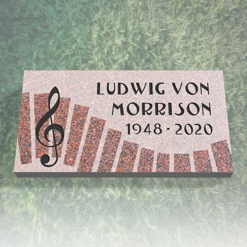 Gravestone with musical notes and the name Ludwig von Morrison, 1948-2020, on grass