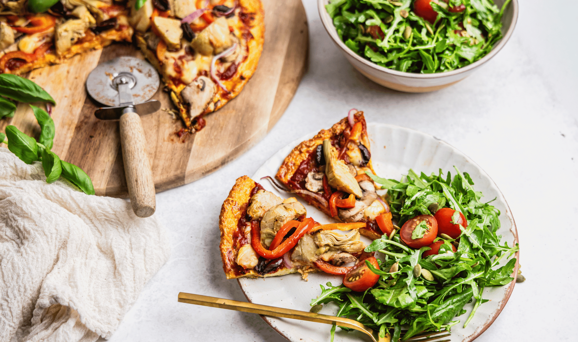 Chicken crust pizza slices with rocket salad