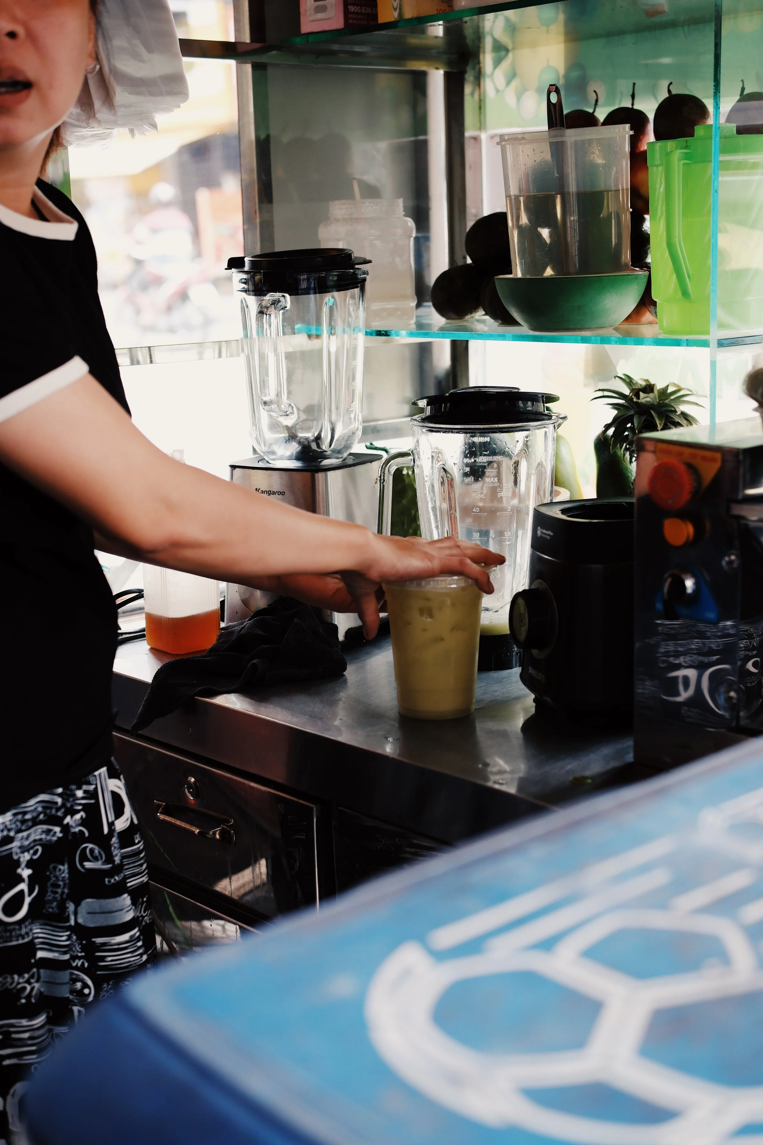 woman making sugarcane juice